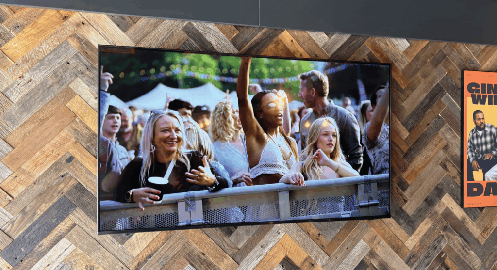 Samsung display showing live content inside Ginger Wings bar and restaurant