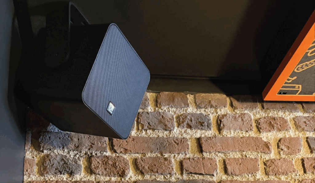 Audac Viro loudspeakers mounted on the ceiling at Ginger Wings for even sound coverage